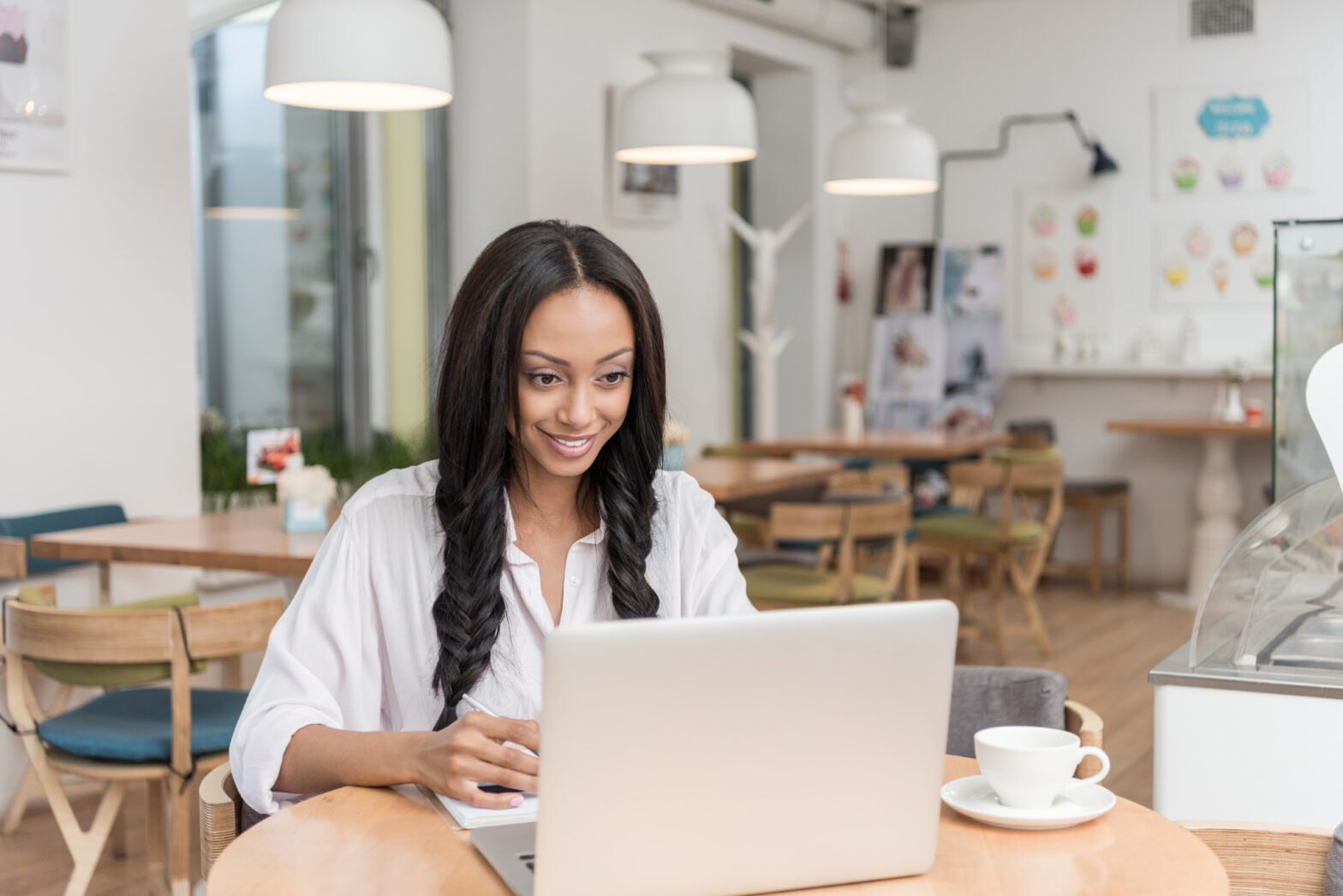 woman on laptop working on LinkedIn engagement