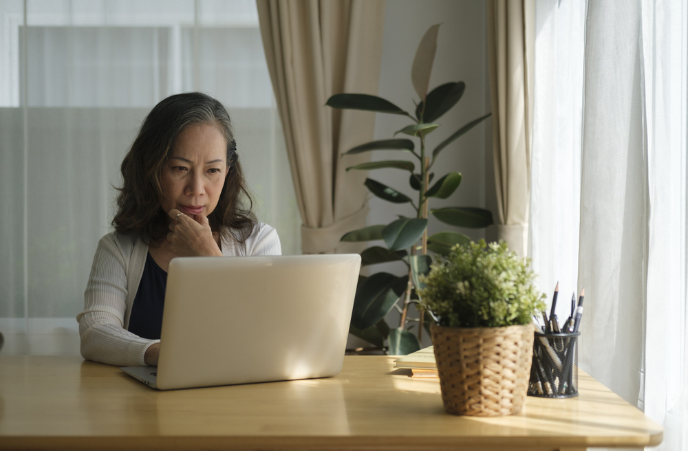 Highly Sensitive business writer at laptop