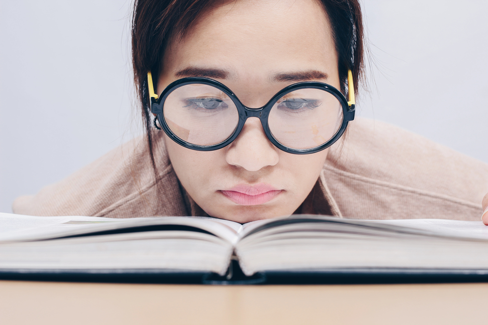Female thought leader sadly reading book