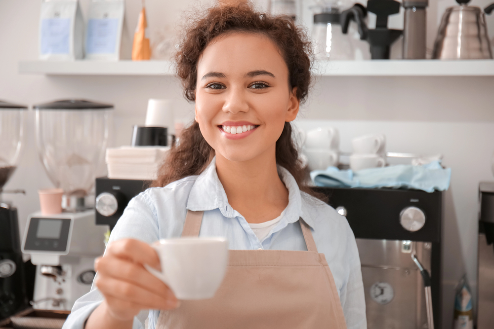 Woman serving coffee order