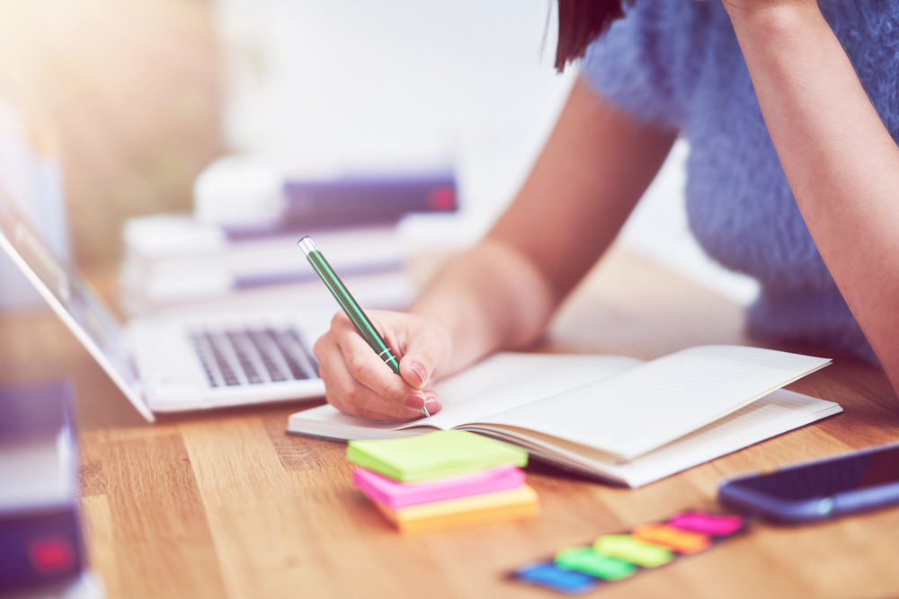 woman at her desk creating a simple content plan